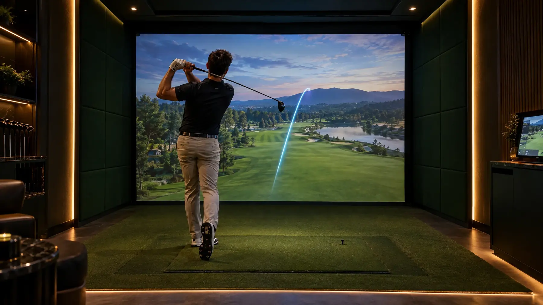 Golfer mid follow-through in a luxury indoor simulator bay with a projected fairway and ball-flight tracer